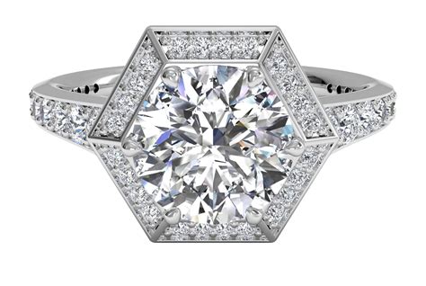 This vintage diamond engagement ring features a tapered band of ...