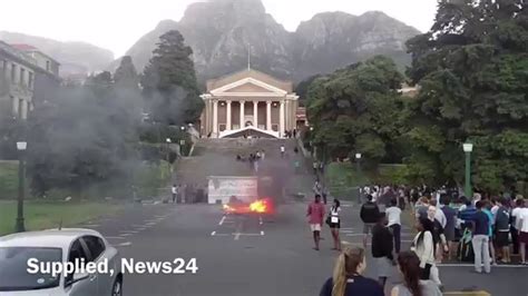 Rhodes Must Fall protesters burn UCT artworks on campus - YouTube