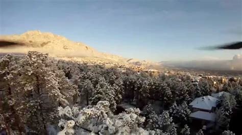 Aerial view of Colorado Springs after an overnight snowfall - YouTube