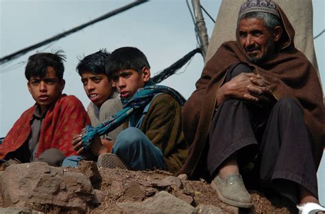 File:US Navy 051017-N-8796S-036 Pakistani people watch from atop a pile ...