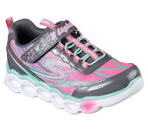 Let there be a nonstop light-up party wearing the Skechers S Lights: Lumos shoe. Shiny patent ...