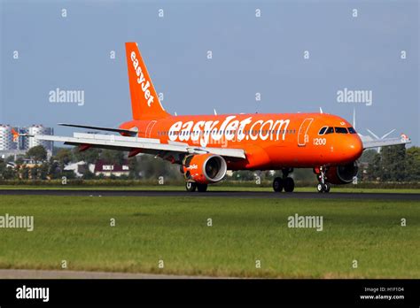 EasyJet (200th Airbus Livery) Airbus A320 touches down on runway 18R at ...