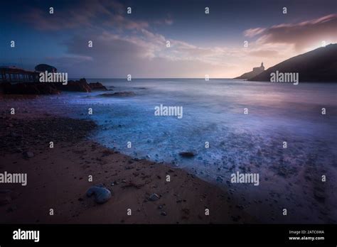 Sunrise at Mumbles beach Stock Photo - Alamy