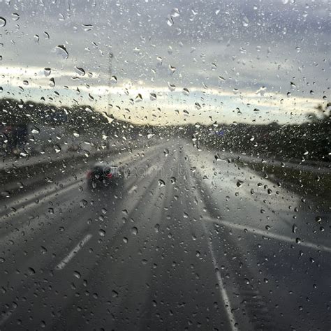 Rain Water Droplets on a Car Window Stock Photo - Image of traffic, light: 91830180