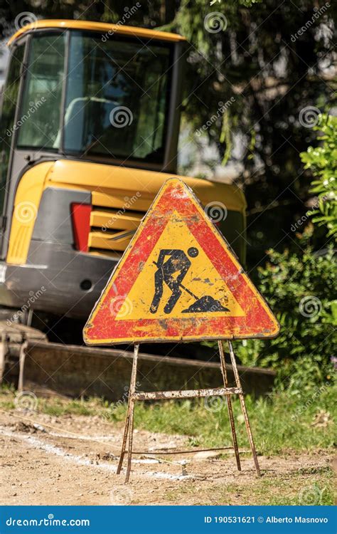 Work in Progress - Triangular Road Sign on the Roadside Stock Image ...