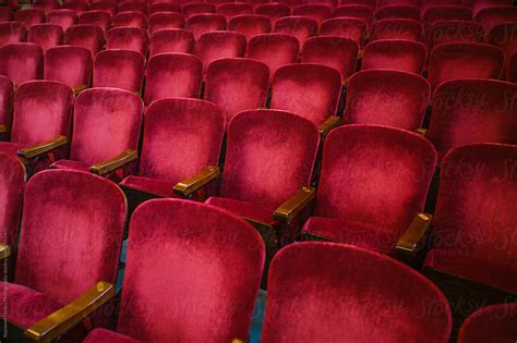 "Plush Velvet Red Theater Seats" by Stocksy Contributor "Raymond Forbes LLC" - Stocksy