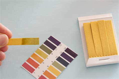 Free Stock image of Close up of person using ph acid testing paper | ScienceStockPhotos.com