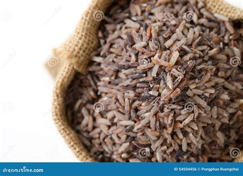 Brown rice in sack bag stock photo. Image of heap, tasty - 54504456