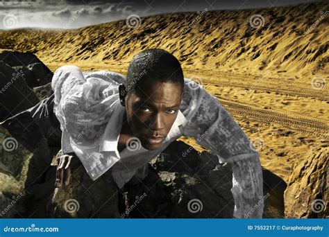 Young Man Crawling on Desert Rocks Stock Image - Image of clouds, arid: 7552217