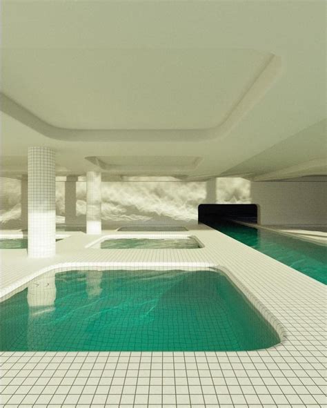 an indoor swimming pool with tiled flooring and white tiles on the ...