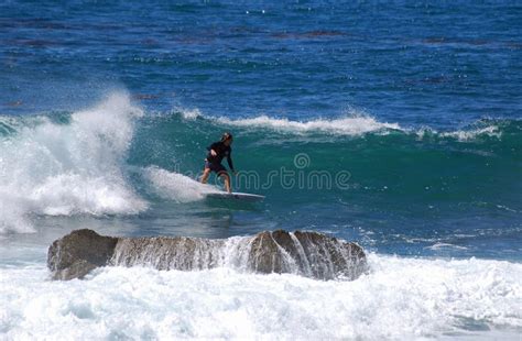 Board Surfer Riding in a Wave at Laguna Beach, CA. Editorial Photo - Image of beach, rock: 43840366