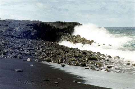 Black sand beach formed by the breakdown of black lava rocks ...