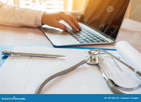 Doctor`s Working on Laptop Computer, Writing Prescription Clipbo Stock Image - Image of arms ...