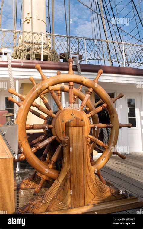 Ships steering wheel on old wooden ship Stock Photo - Alamy