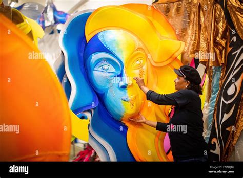 Clary Salandy adjusts a costume for the first Notting Hill virtual carnival at her shop in ...