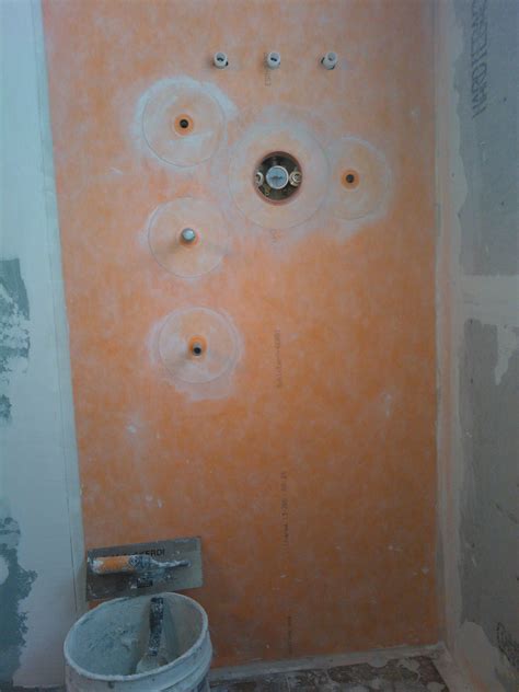 What are the pros and cons of adding a vapor barrier behind shower backer board? | Backerboard ...