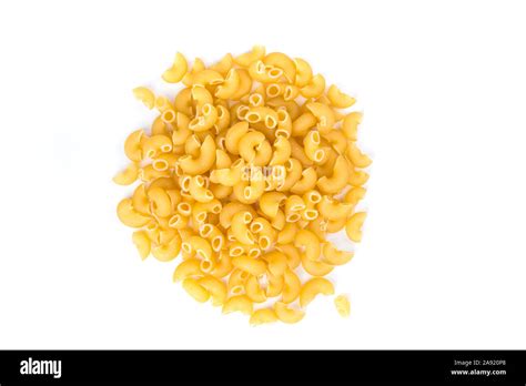 PIle of yellow dried elbow macaroni pasta shapes Stock Photo - Alamy