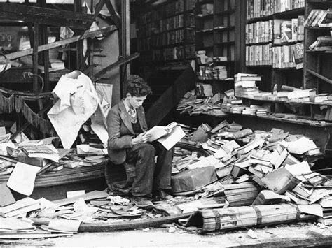 A boy sits in the ruins of a London bookshop, reading a book titled ...