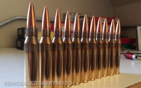 The Differences Between 338 Lapua vs 50 BMG Ammo - WeaponSpecialist