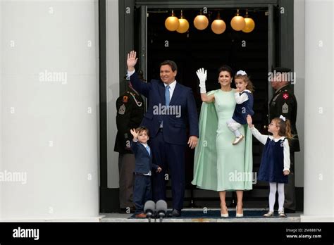 Florida Gov. Ron DeSantis waves as he stands with his wife Casey and ...