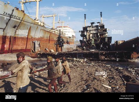 Indian workers working at Alang ship breaking yard ; Alang ; Bhavnagar ; Gujarat ; India ; Asia ...