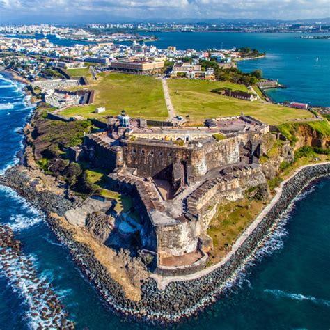 Aerial view of a huge fort on an ocean cliffside in San Juan Puerto ...