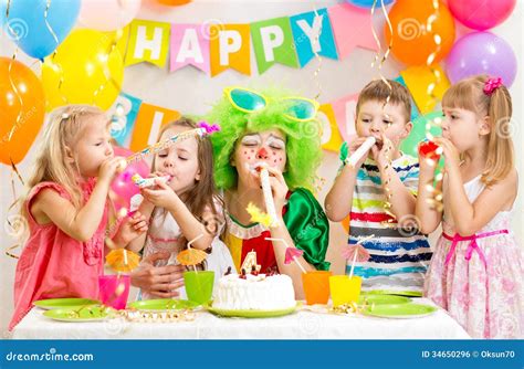 Kids And Clown Celebrate Birthday Party Stock Photo - Image of glasses, birthday: 34650296