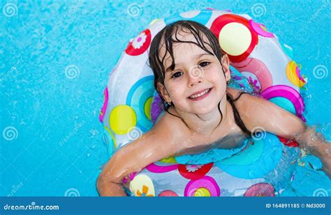 Little Girl in Swimming Pool with Float Ring Stock Image - Image of ...