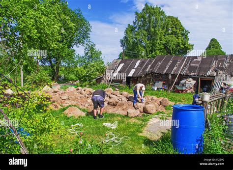 Construction of rural house foundation with use of natural boulders Stock Photo - Alamy