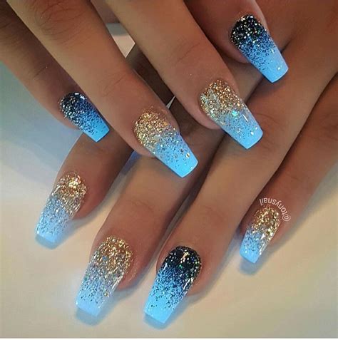 Blue glow in the dark coffin nails manicure with gold glitter and blue glitter ombre effect ...