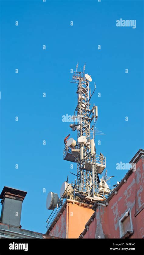 tv antenna under a blue sky Stock Photo - Alamy