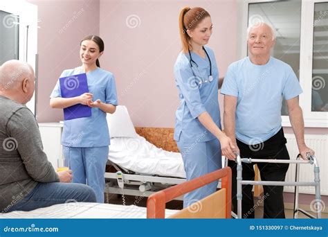 Nurses with Senior Patients in Hospital Ward Stock Image - Image of ...