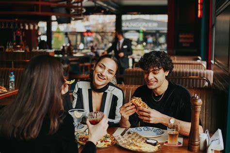 Group of Person Eating Indoors · Free Stock Photo