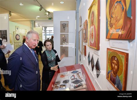 The Prince of Wales studies the work of Artist Rosie Morton during a visit to the degree show at ...