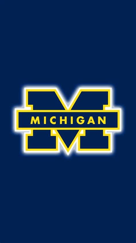 the michigan wolverines logo is shown on a dark blue background with ...