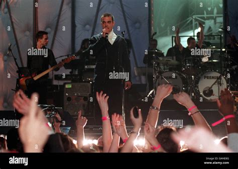 Robbie Williams on stage during the Brit Awards, at the London Arena ...