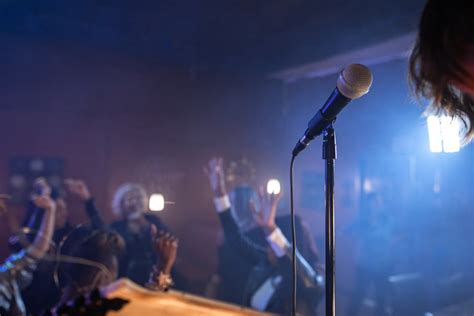 Microphone on Stage in Front of People Dancing · Free Stock Photo