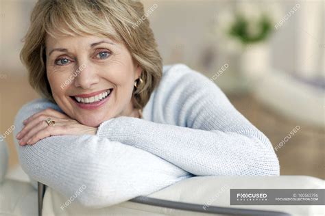 Attractive mature woman smiling — looking, Head In Hands - Stock Photo ...