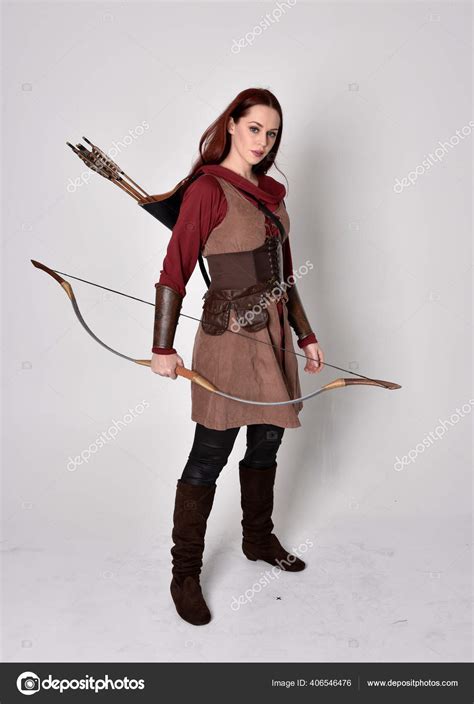 Full Length Portrait Girl Red Hair Wearing Brown Medieval Archer Stock Photo by ©faestock 406546476