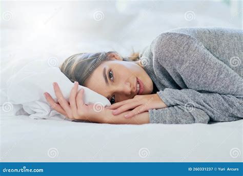 I Need To Catch Up on Some Sleep. Portrait of an Attractive Young Woman Lying Bed while Smiling ...