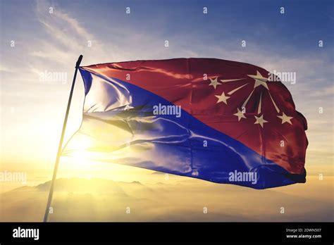 Central province of Papua New Guinea flag waving on the top sunrise ...