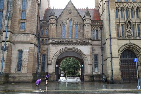 Manchester University apologises after students tear down fences erected round halls of ...