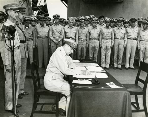 General Douglas MacArthur signing the Japanese Instrument of Surrender ...