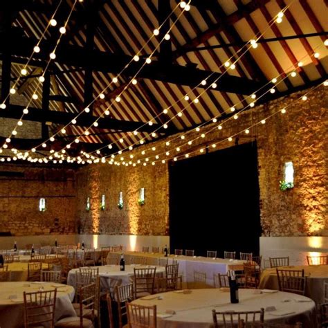 Lights create a magical effect for a barn wedding. | Festoon lighting, Barn wedding lighting ...