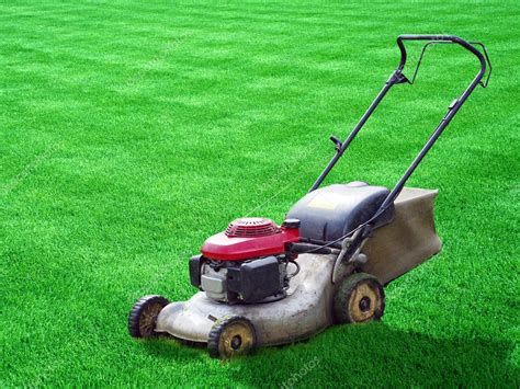 Lawn mower on green grass backyard — Stock Photo © bahtadz #1359160