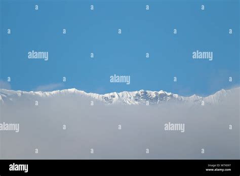 Snow mountains with clouds, Mount Qomolangma National Park, Dingjie ...