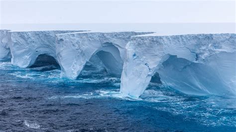 A23a iceberg seen with striking arches and cavernous hollows as it ...