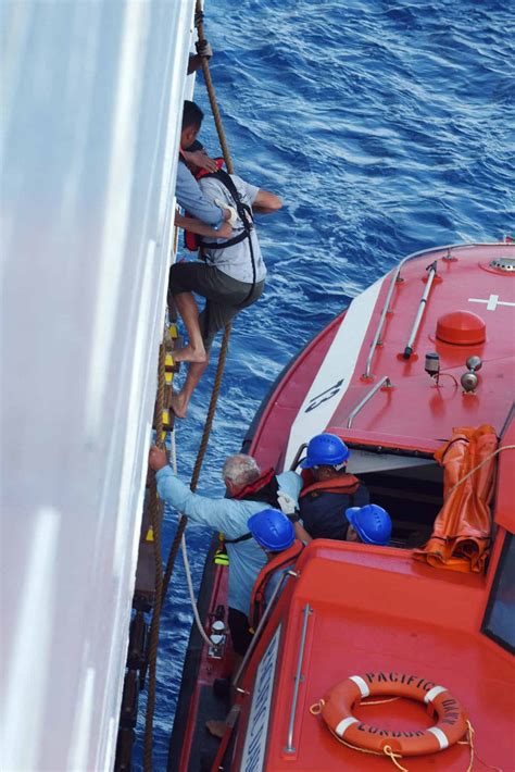 Cruise Ship Rescues Passengers From Sinking Yacht [PHOTOS]