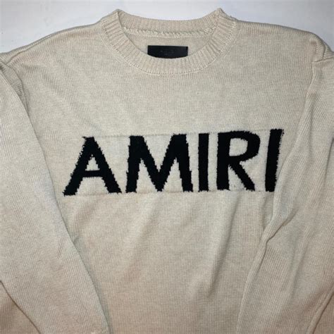 amiri cream distressed logo sweater • worn once... - Depop