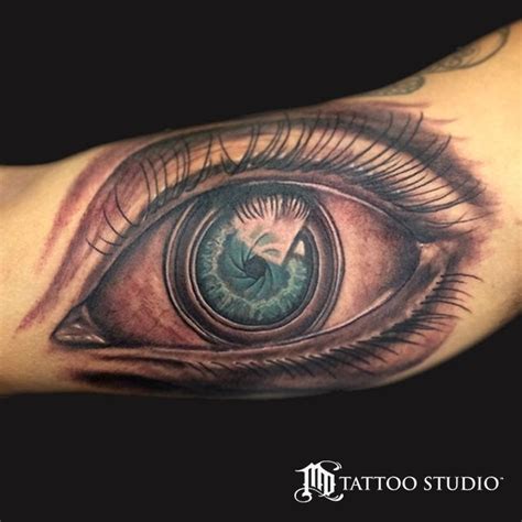 camera lens eye tattoo | Leg tattoos, Tattoos, Tattoo studio